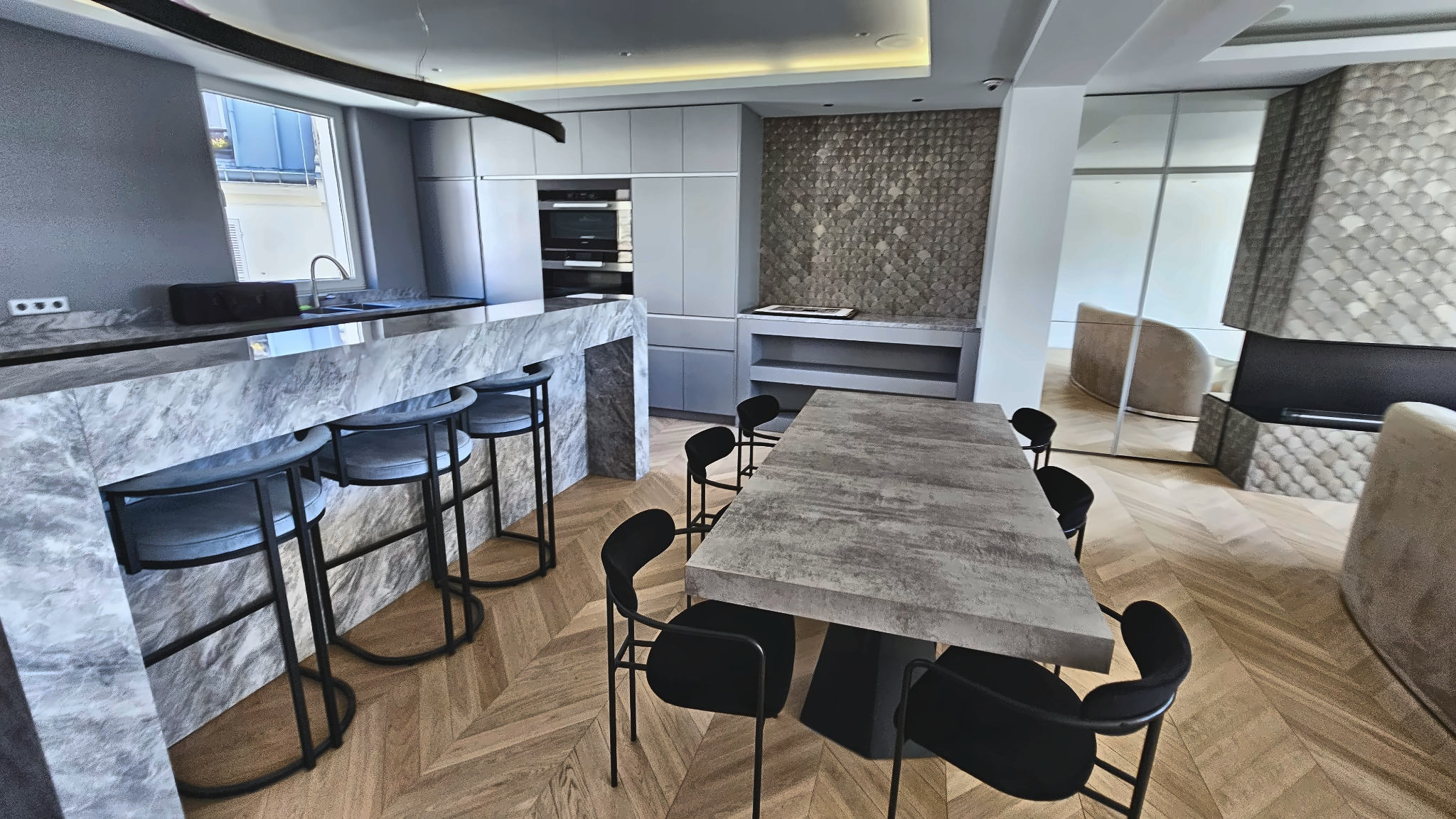 Rénovation cuisine Paris 15e — îlot marbre gris et parquet chevron AGV Rénov